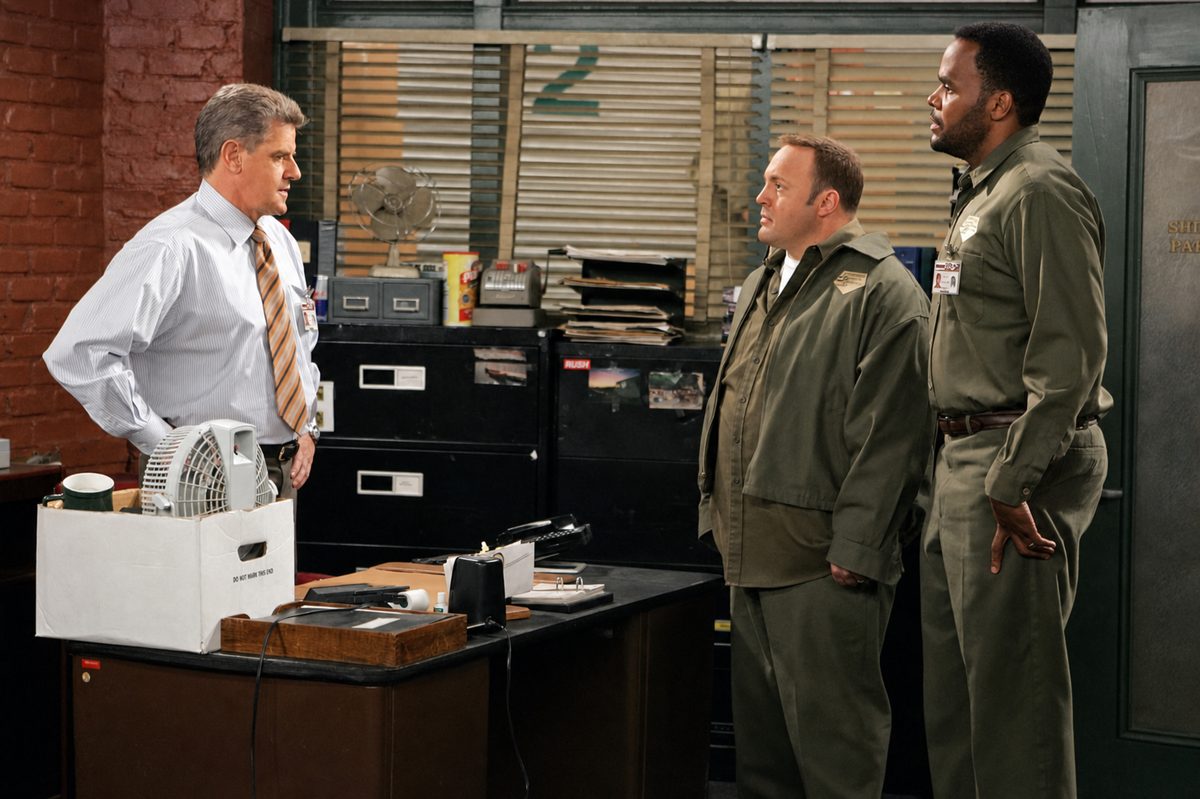 Sam McMurray as O'Boyle facing Kevin James and Victor Williams in a delivery depot office.